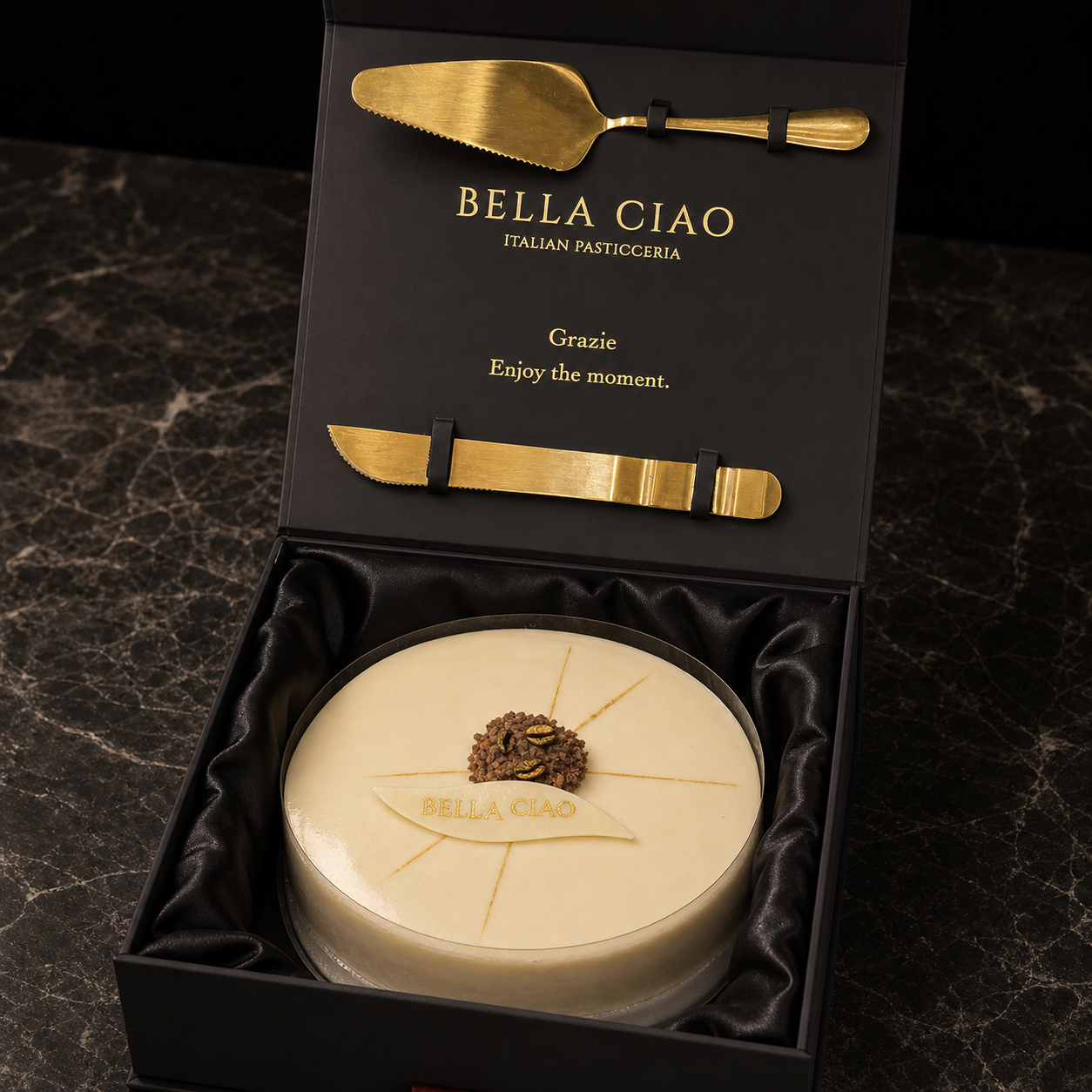 Tiramisù presented in a Bella Ciao gift box for sharing at the table.